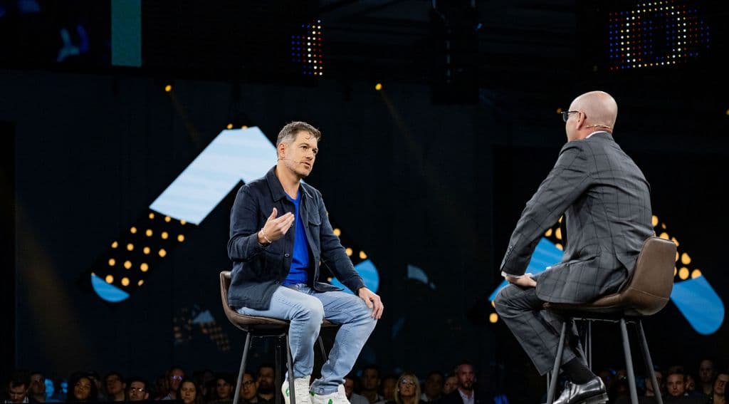 Martin Kon, president and COO of Cohere and Evan Goldberg, EVP of NetSuite, discuss AI onstage during the opening keynote.